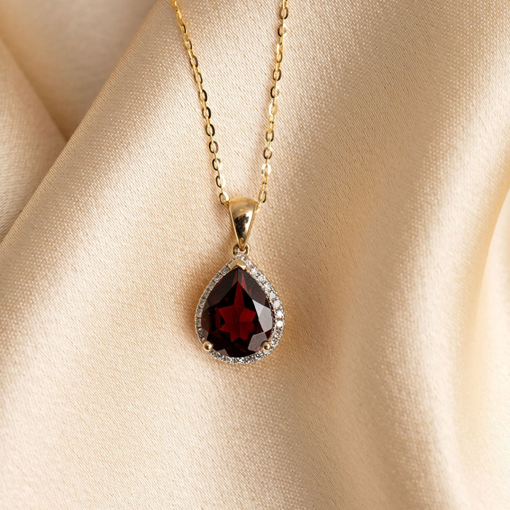 Garnet & Diamond Necklace on silk background