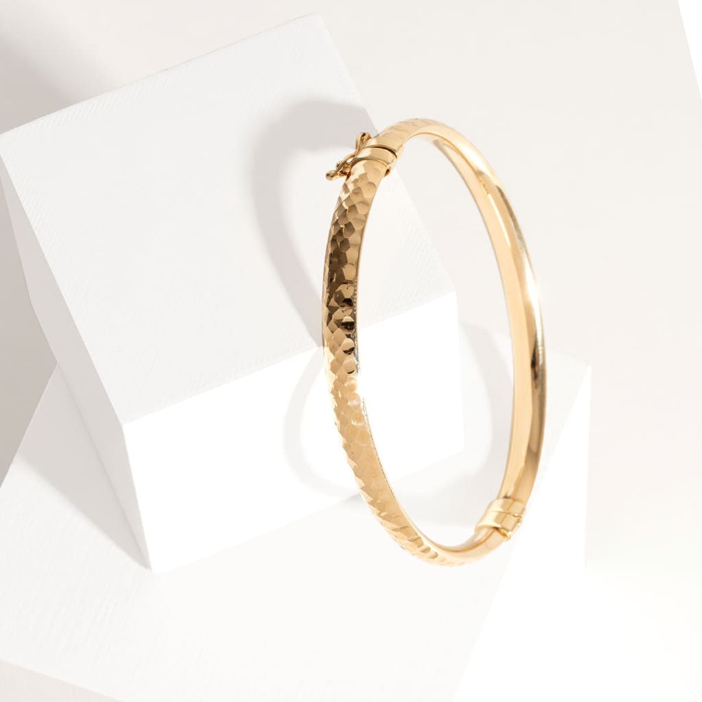 diamond cut yellow gold bangle 