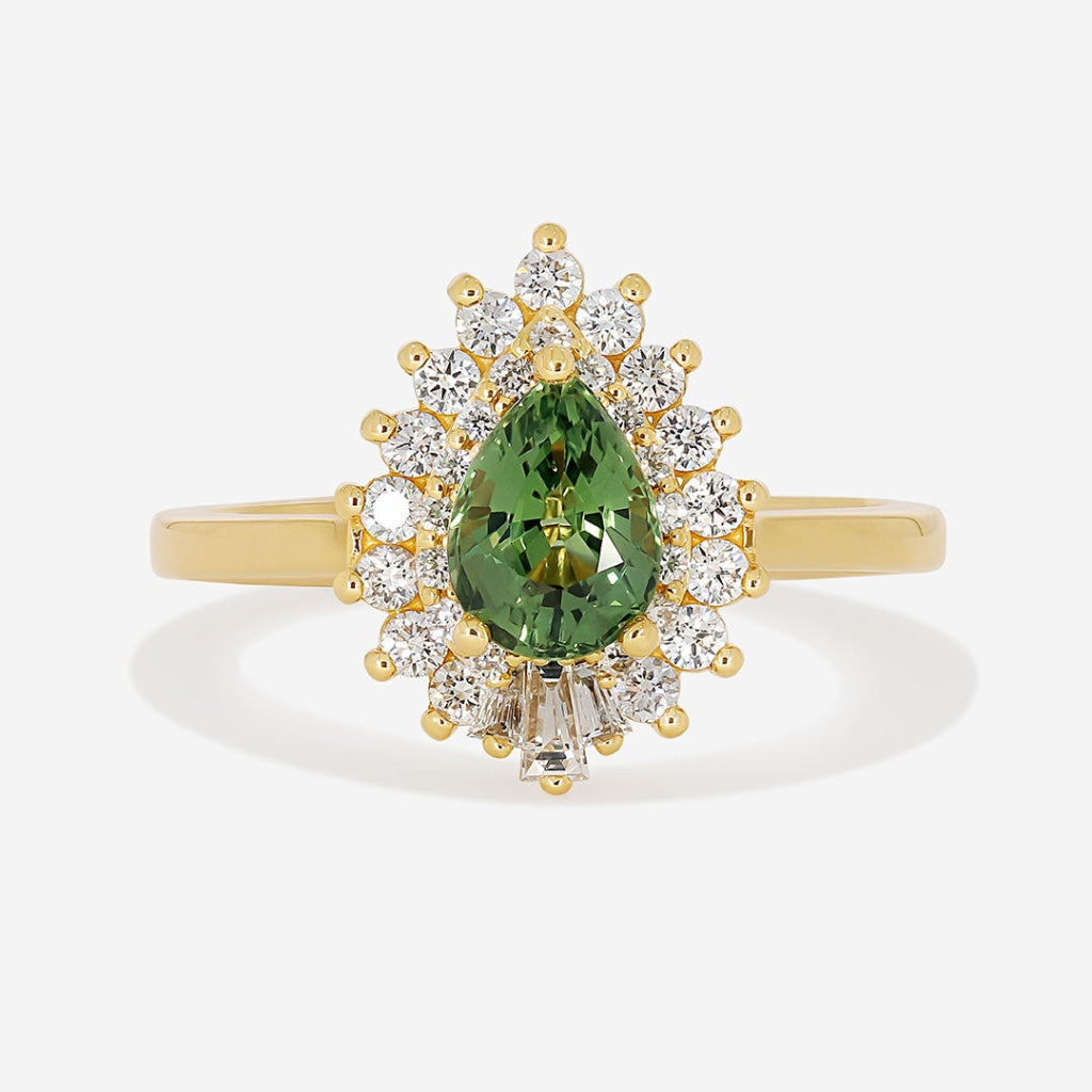 Green sapphire diamond ring on white background