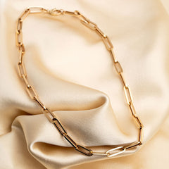 9ct gold chunky paper chain necklace on fabric