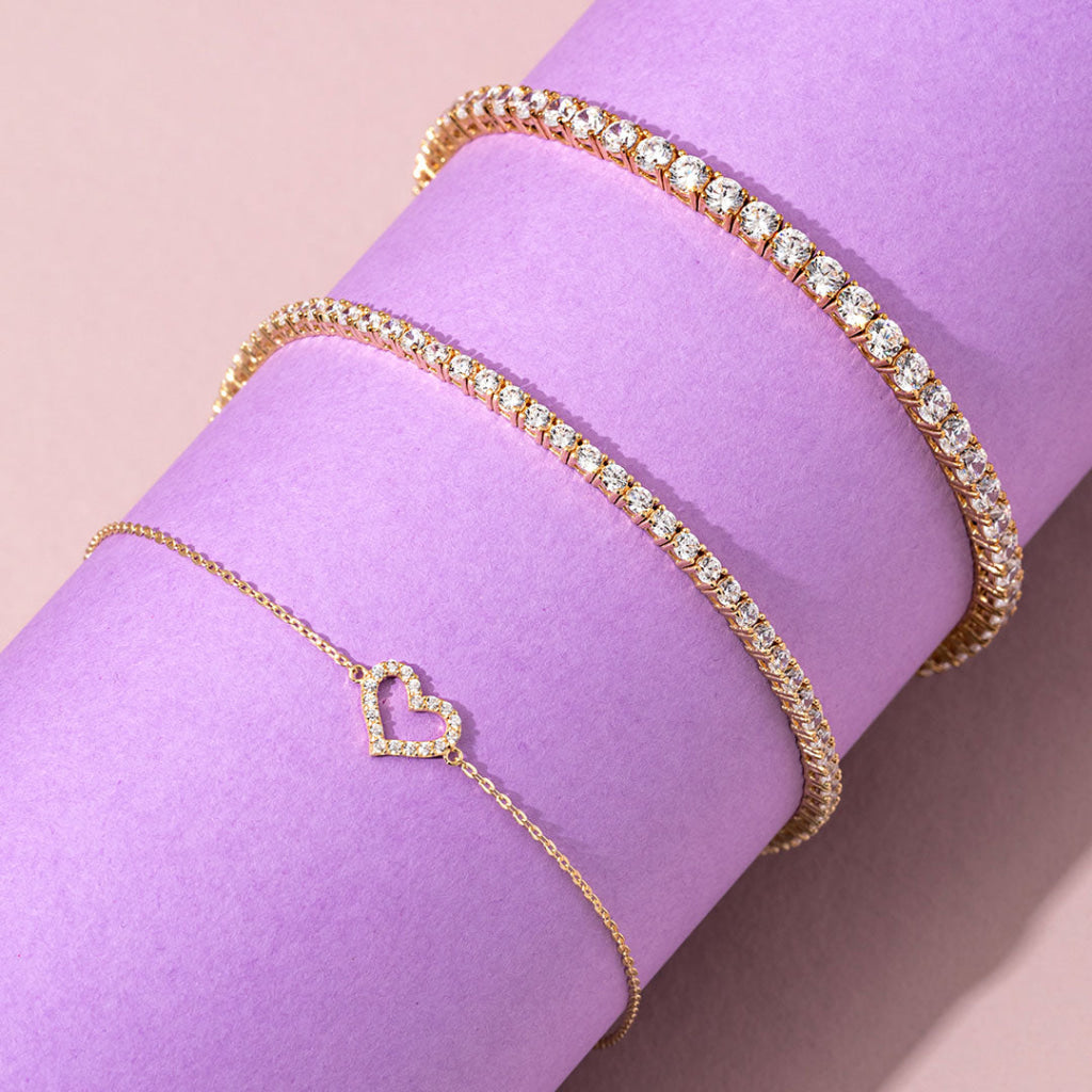 2 tennis bracelets IN GOLD AND A HEART BRACELET IN GOLD