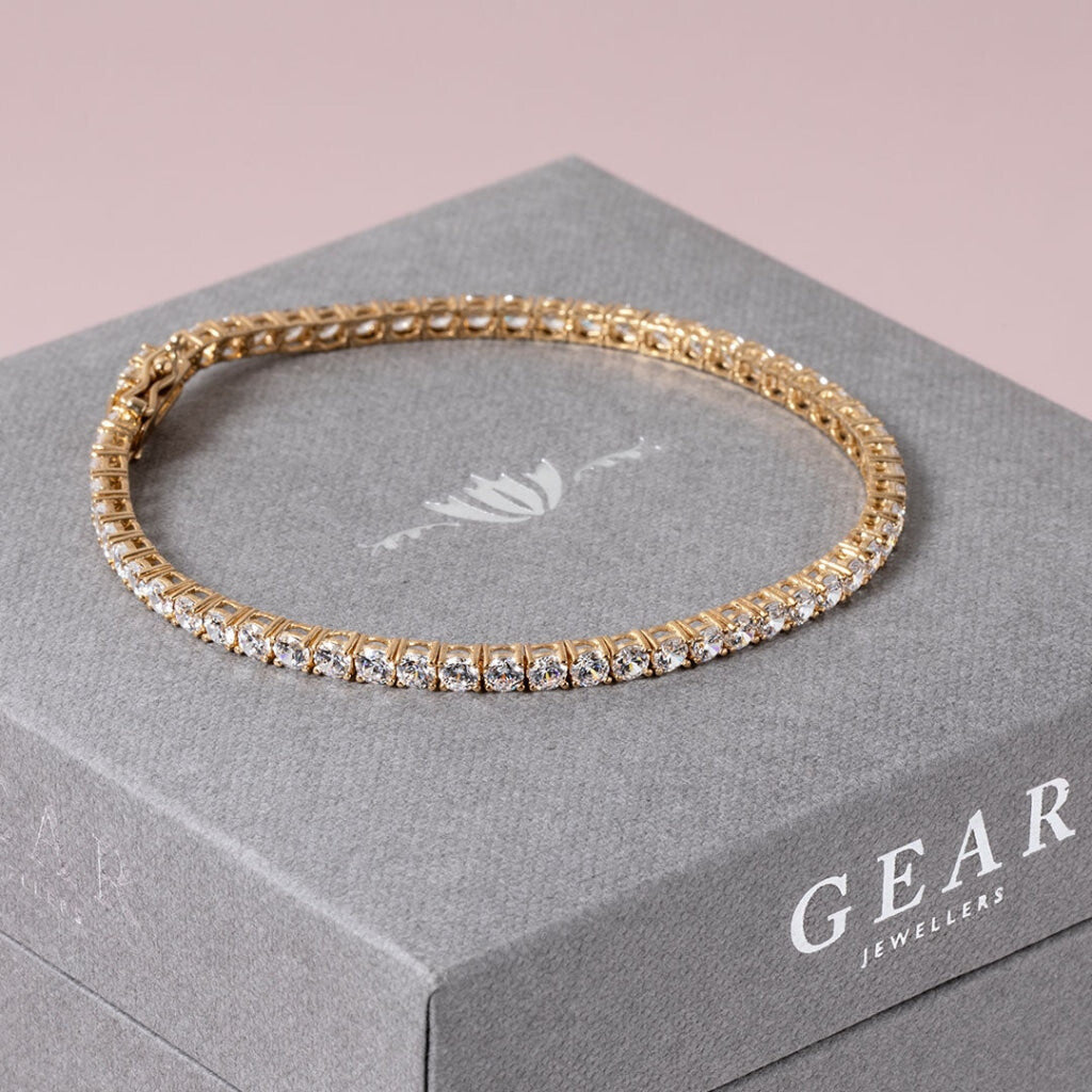 9ct gold classic tennis bracelet on gear jewellers box