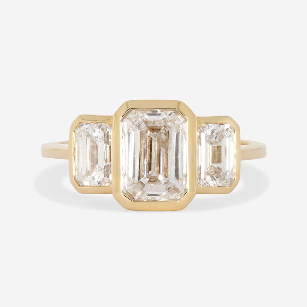 emerald cut three stone engagement ring