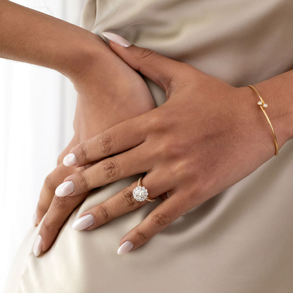 diamond engagement ring on models hand
