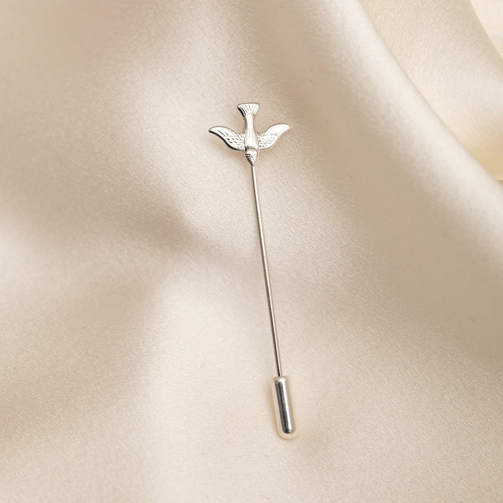 confirmation tie pin on light fabric