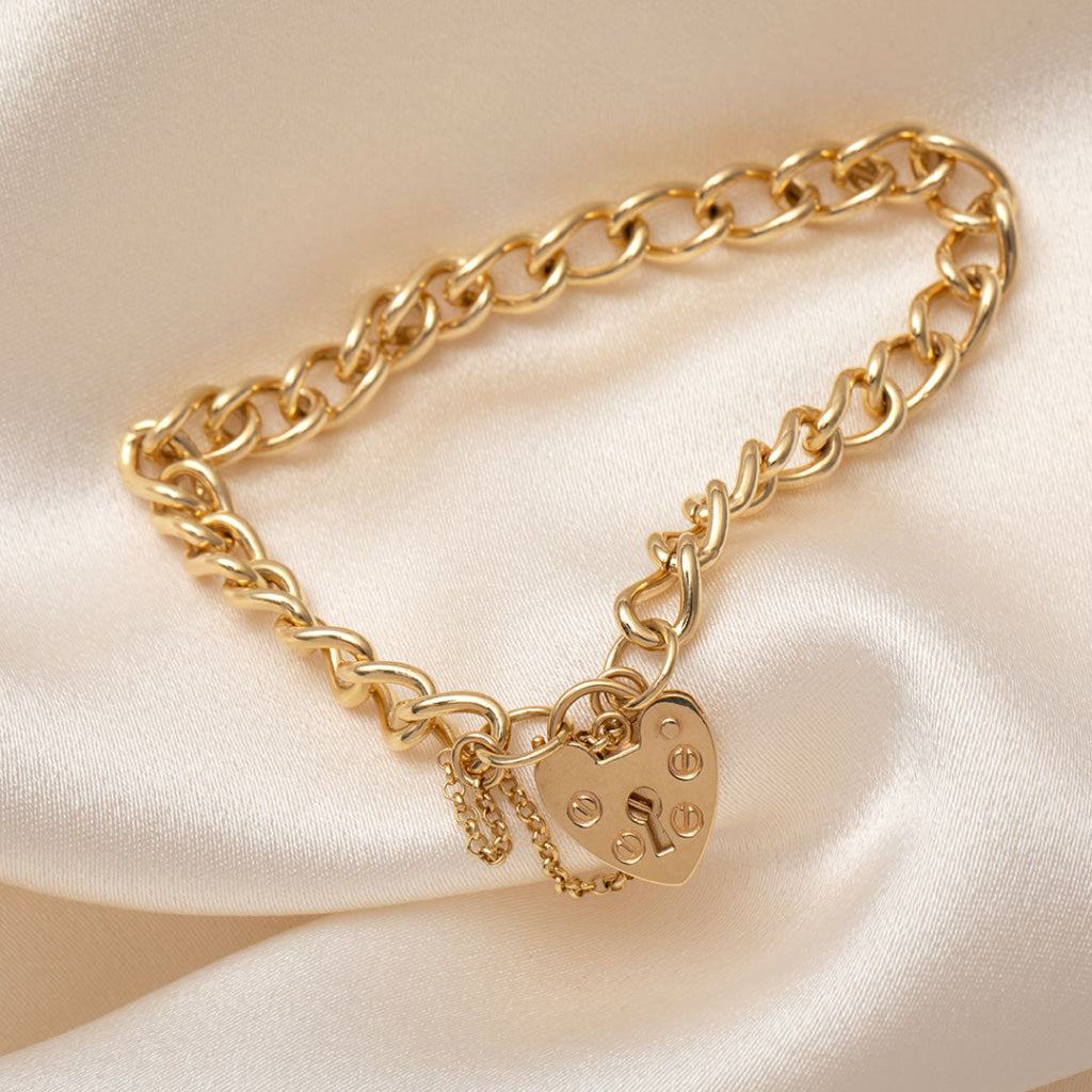 solid heart charm bracelet in yellow gold