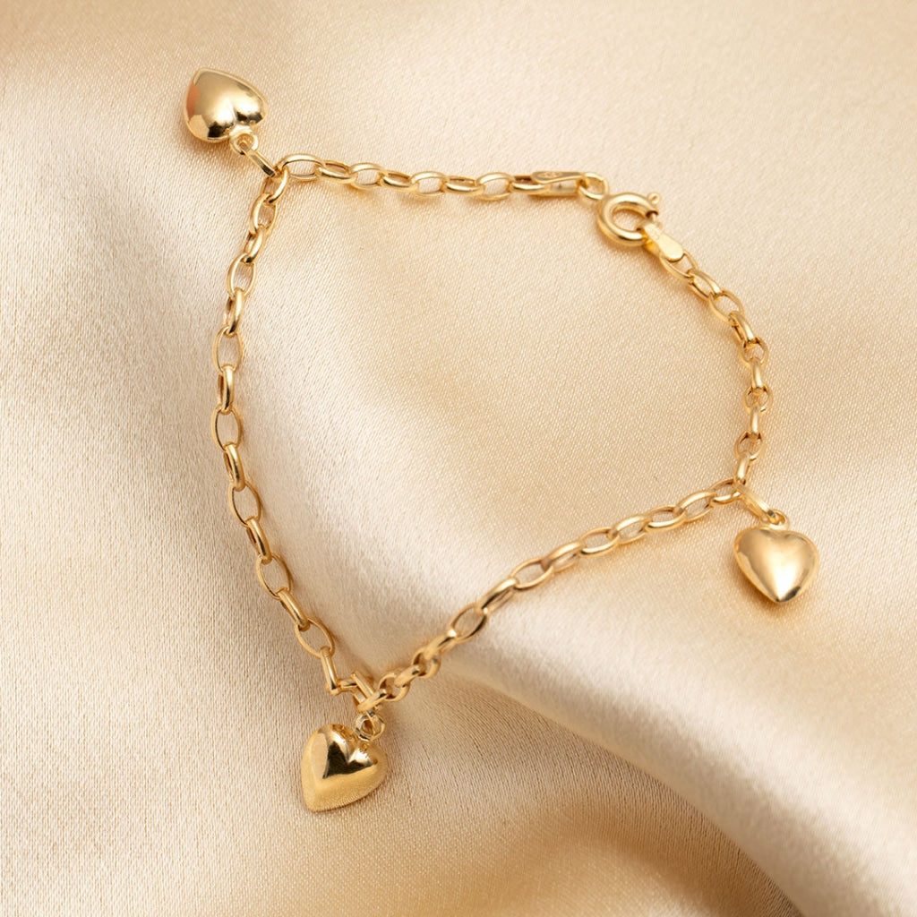 Croí Bracelet | 9ct Gold - heart bracelet on fabric