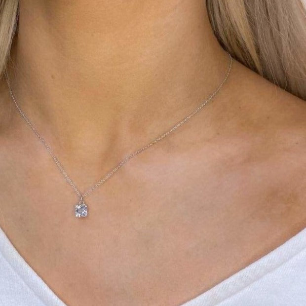 woman wearing sterling silver asscher cut necklace 