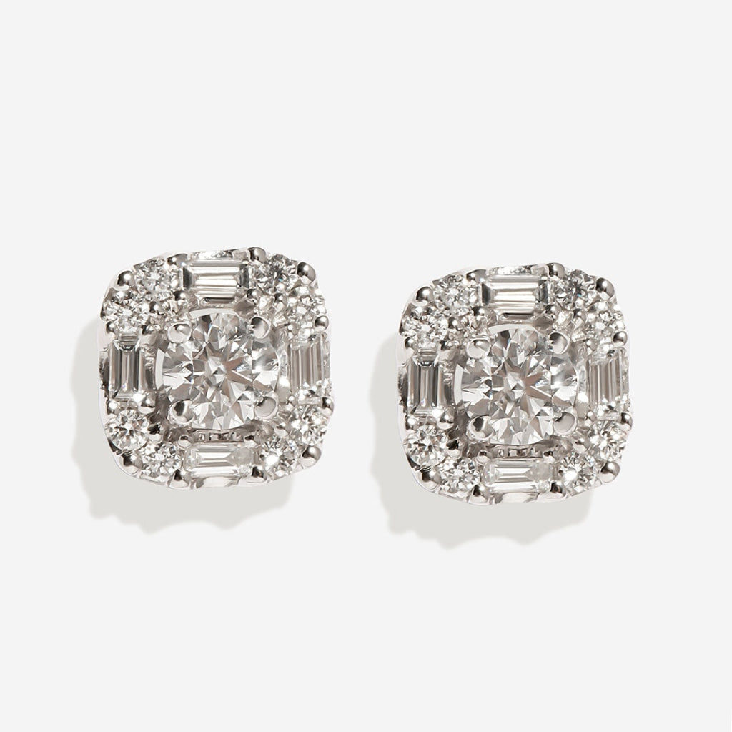 Cushion halo diamond earrings on white background