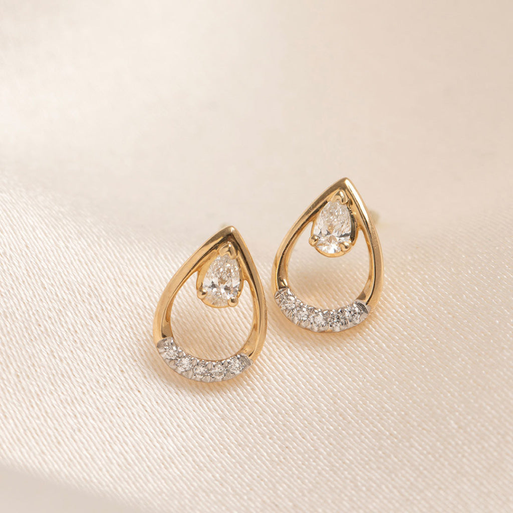 pear cut diamond set stud earrings 