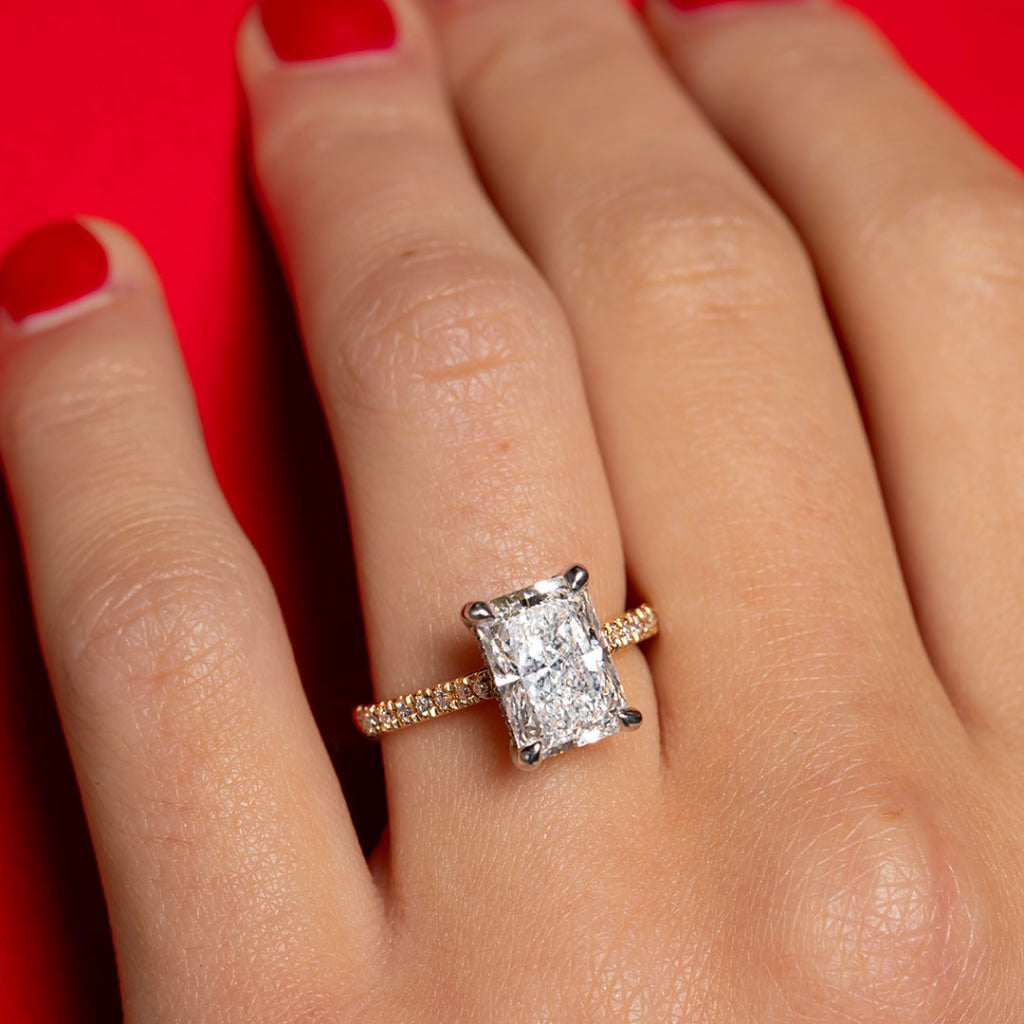 Up close image of Davis engagement ring on hand model