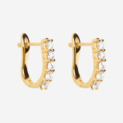 yellow gold diamond huggies on white background