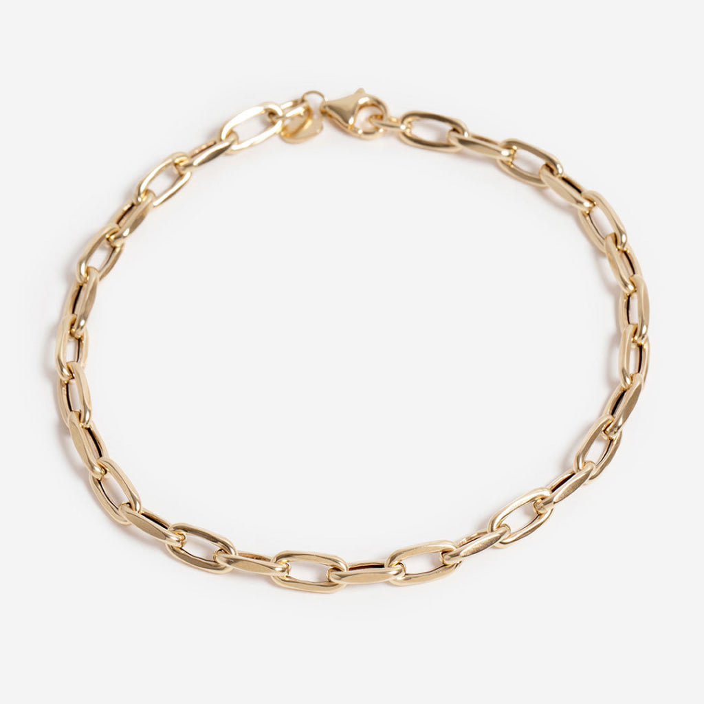 14ct gold oval link bracelet on white background