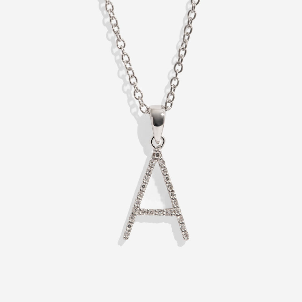 Letter A with diamonds on white background