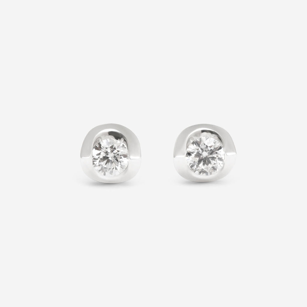 white gold diamond earrings on white background