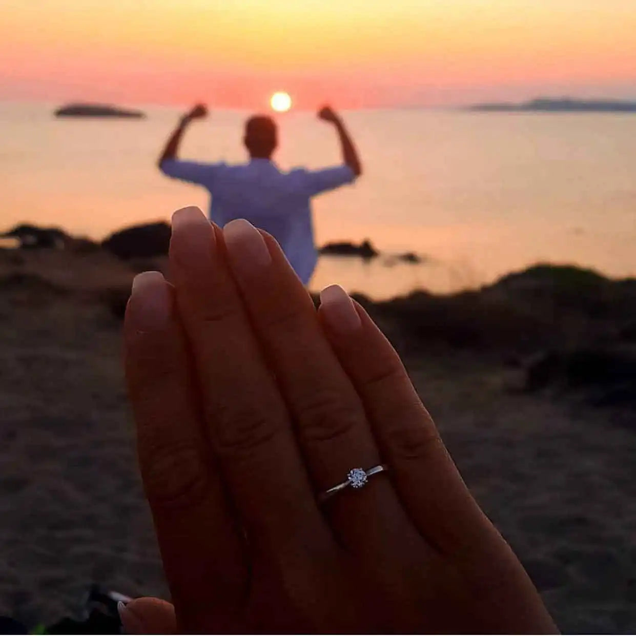 files/diamond-engagement-ring-hand-sunset.webp