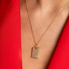 Diamond disc necklace on  model wearing red top