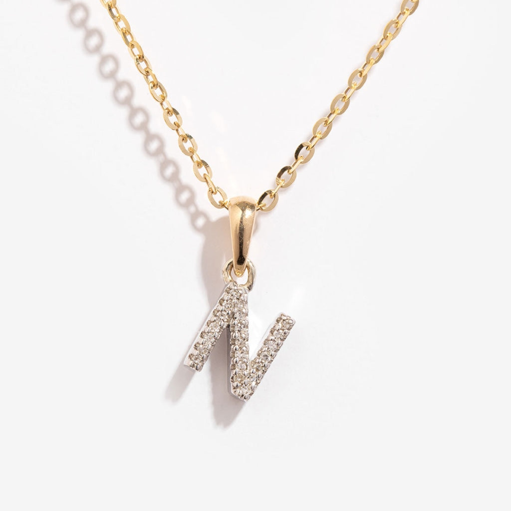 Mini diamond initial on a gold chain N