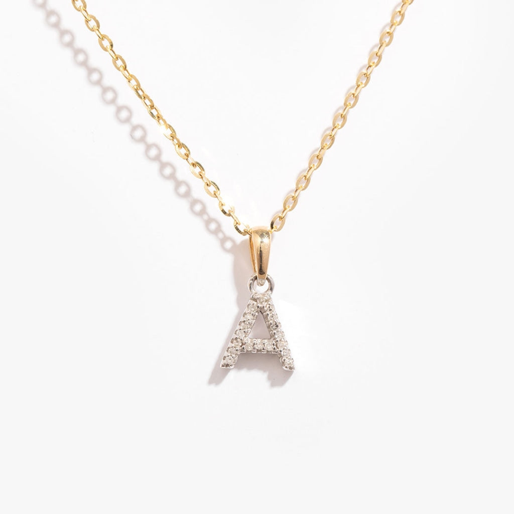 Diamond initial A necklace with a gold chain