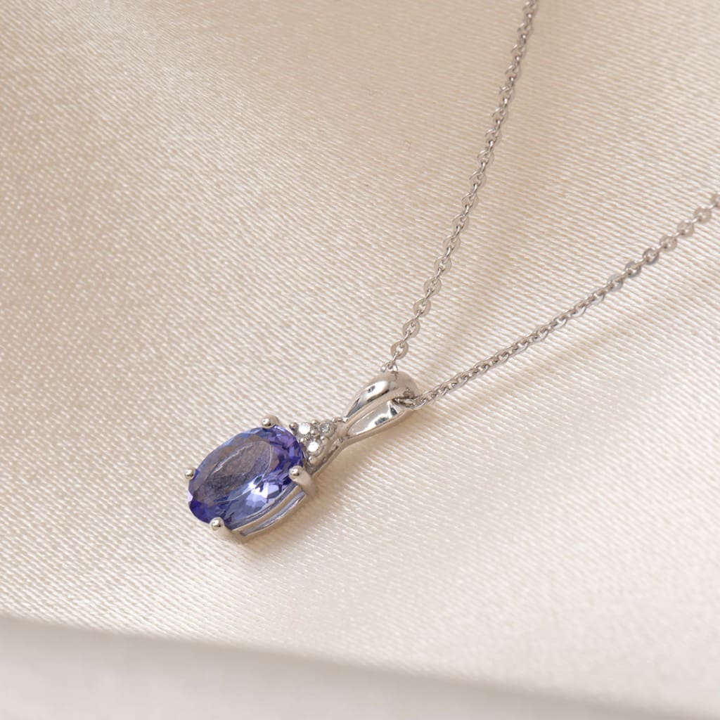 white gold tanzanite pendant on fine trace chain