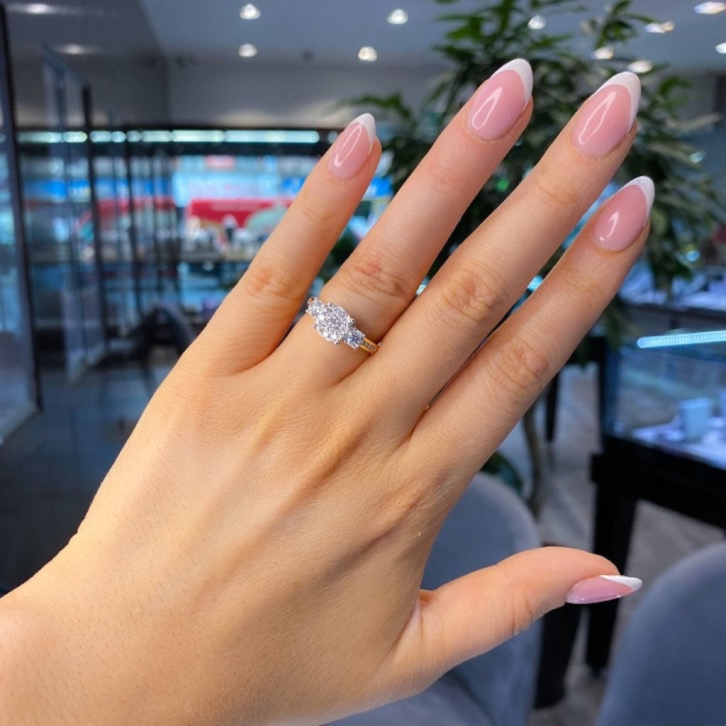 Diamond engagement ring on models finger