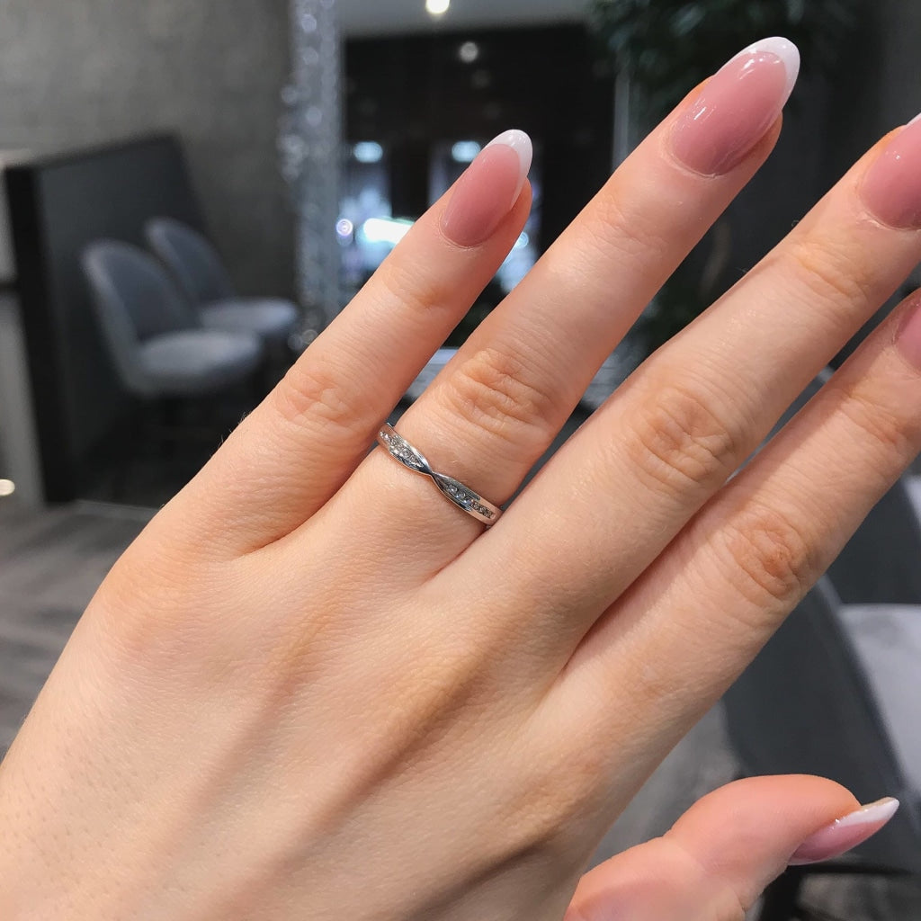 Diamond Wedding Ring on a woman's hand.