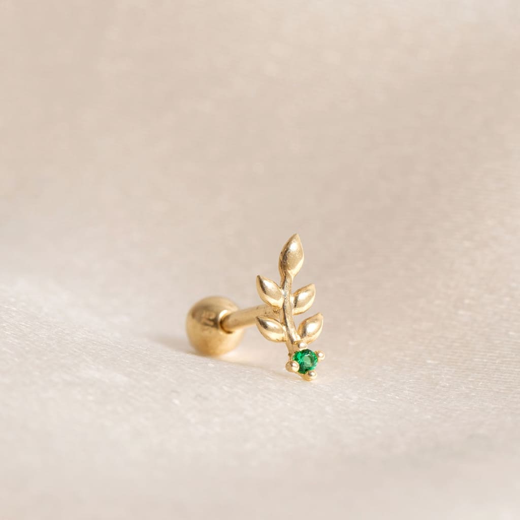 close up of leaf piercing with green cubiz zirconia stone