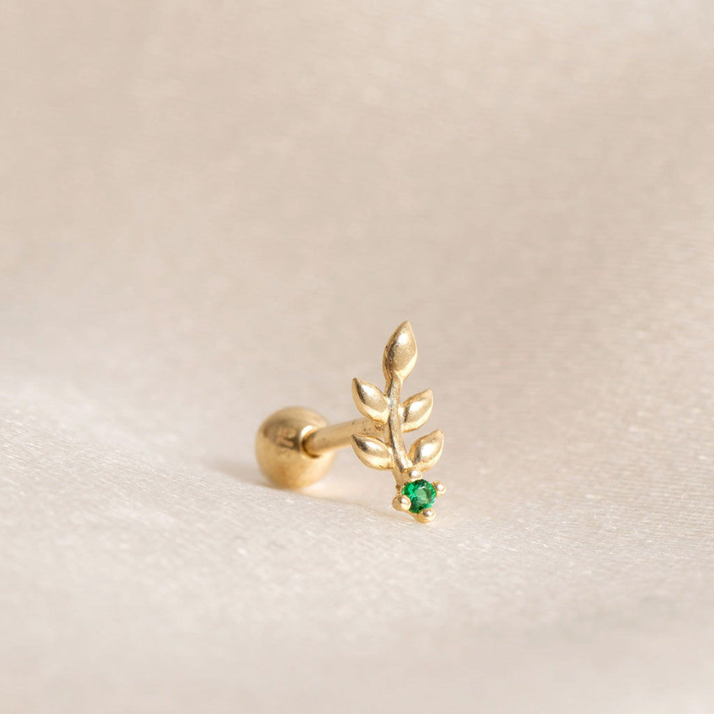 close up of leaf piercing with green cubiz zirconia stone