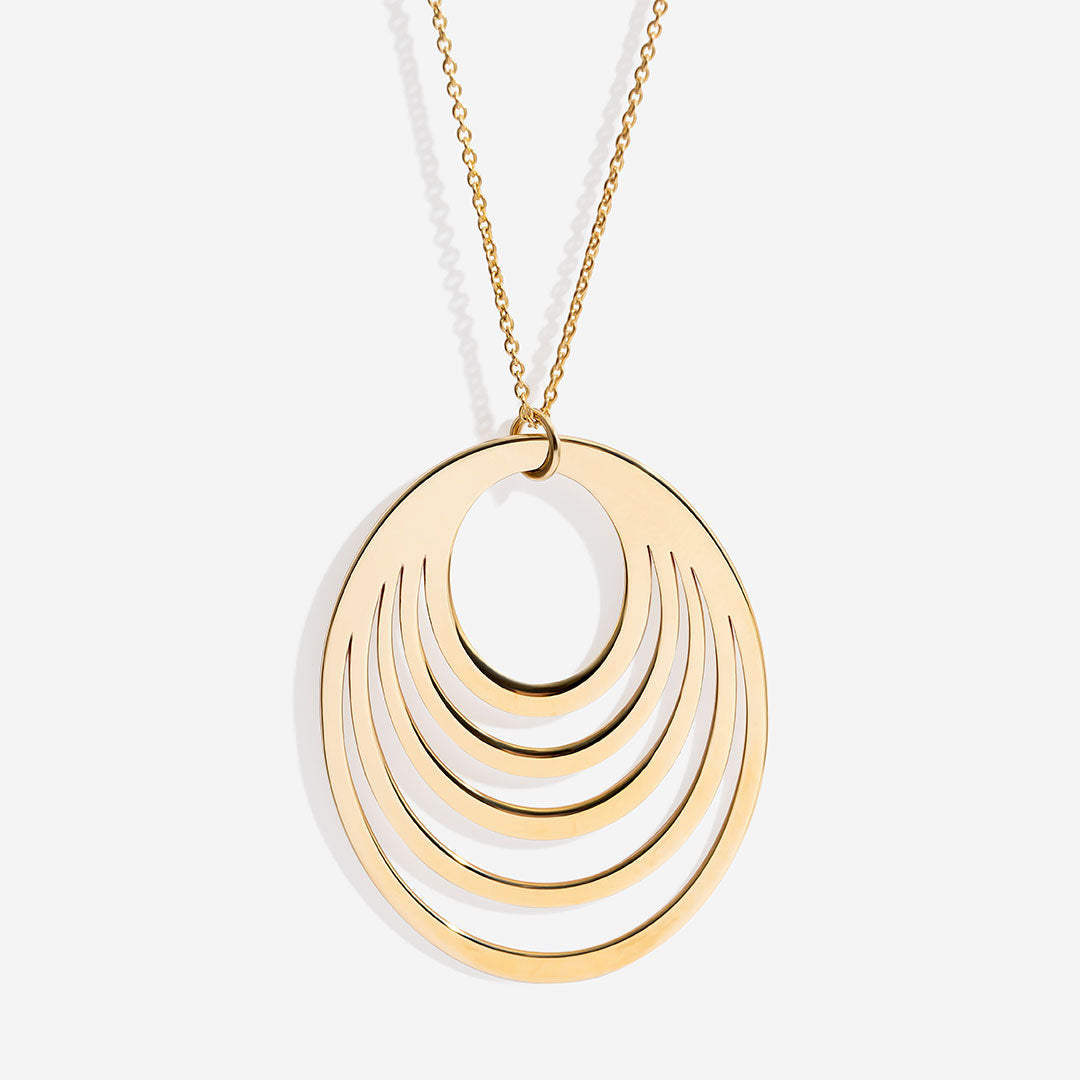 eclipse gold necklace on white background