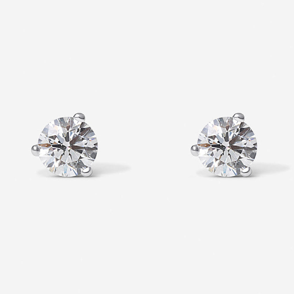 3 claw round diamond earrings.