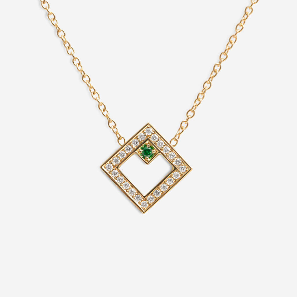 diamond and tsavorite necklace on white background