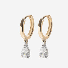 Diamond pear drop earrings on white background