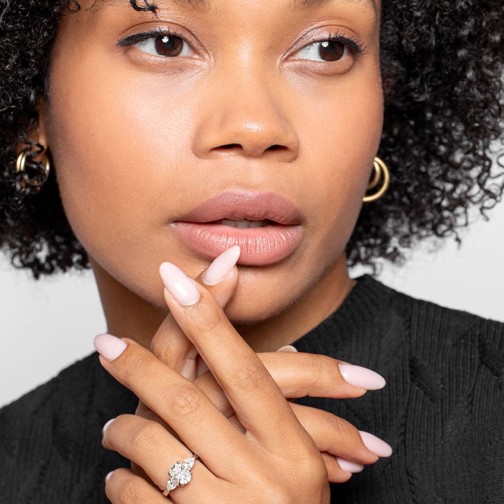 Woman wearing Elysian diamond engagement ring