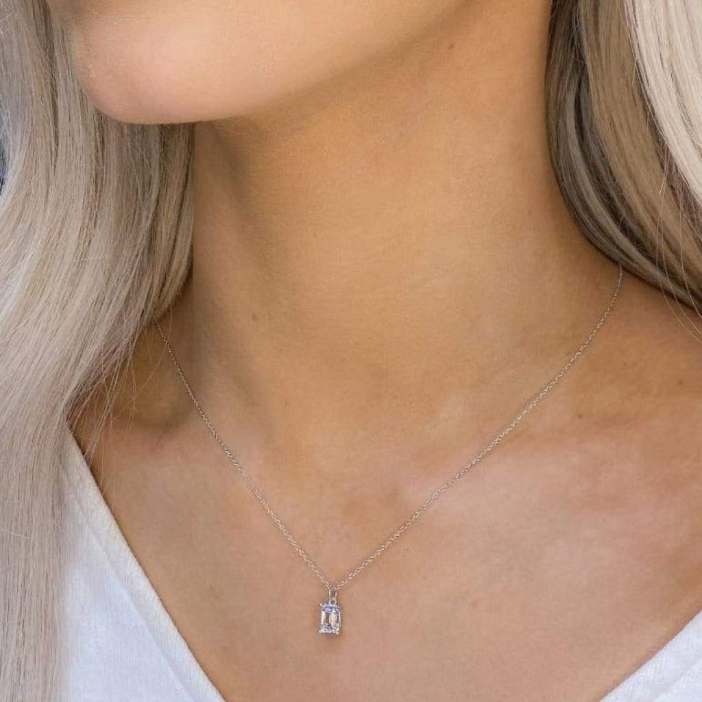 woman wearing sterling silver emerald cut necklace 