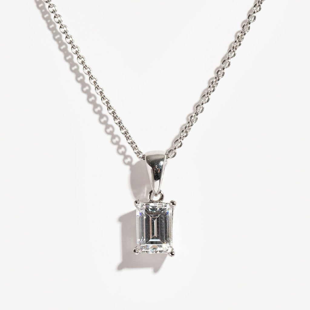 sterling silver emerald cut necklace on white background