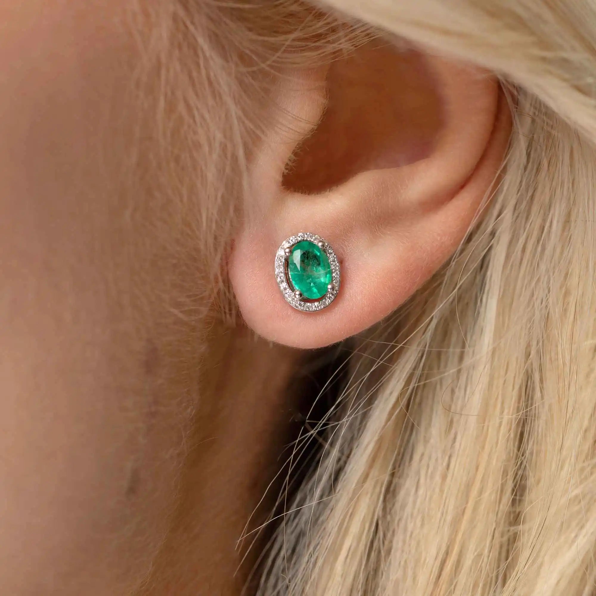 Image of woman wearing emerald and diamond earrings | Gear Jewellers Dublin