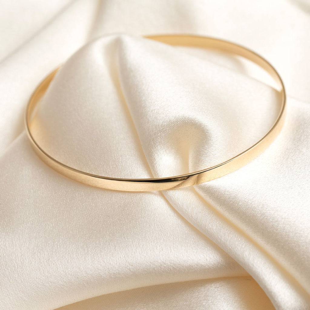 Yellow Gold plain bangle on fabric