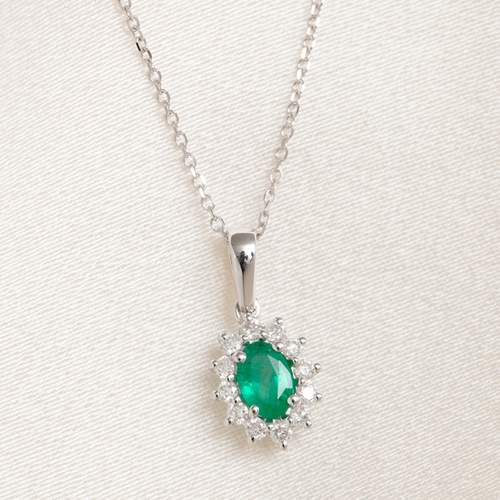 diamond and emerald pendant on trace chain