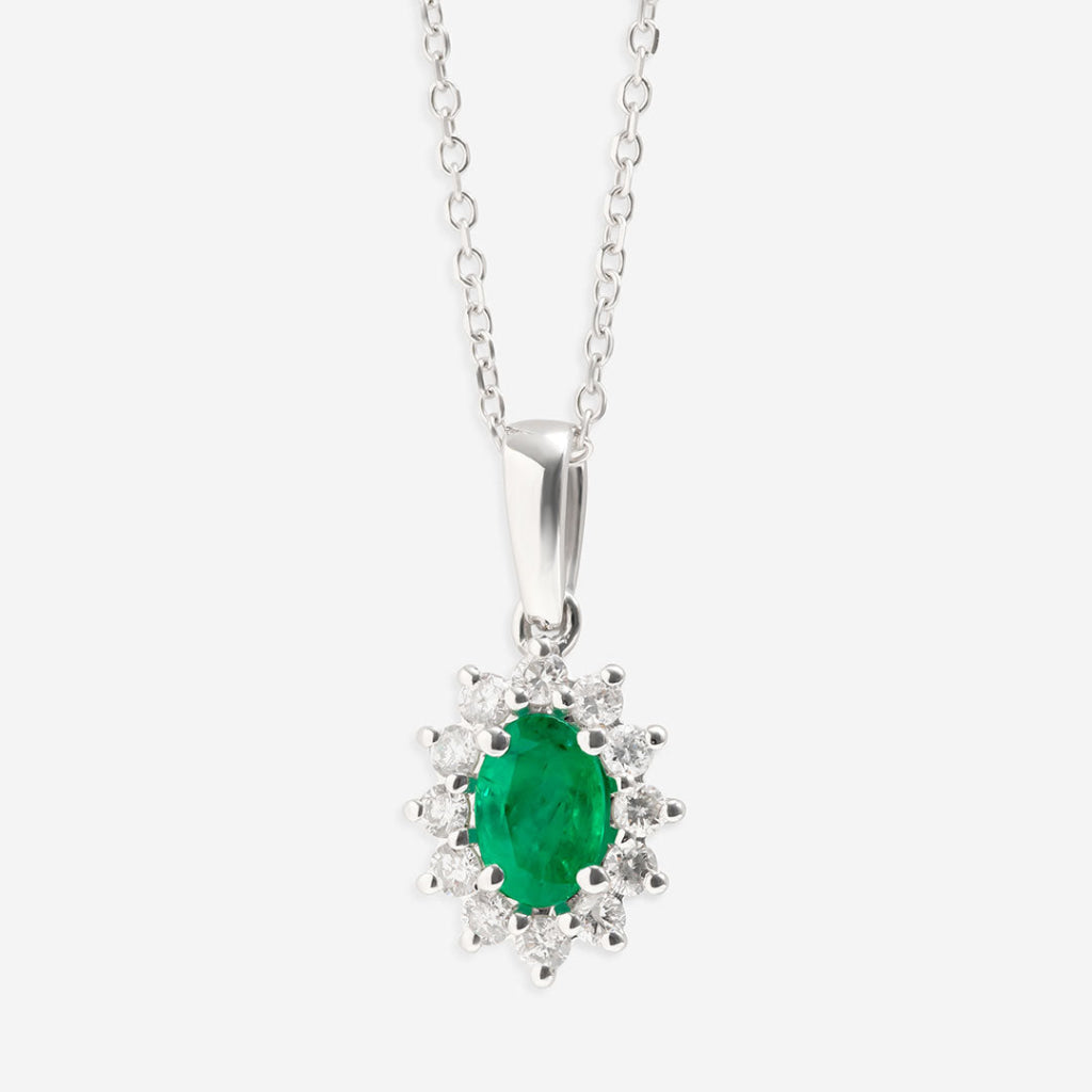 diamond and emerald necklace on white background