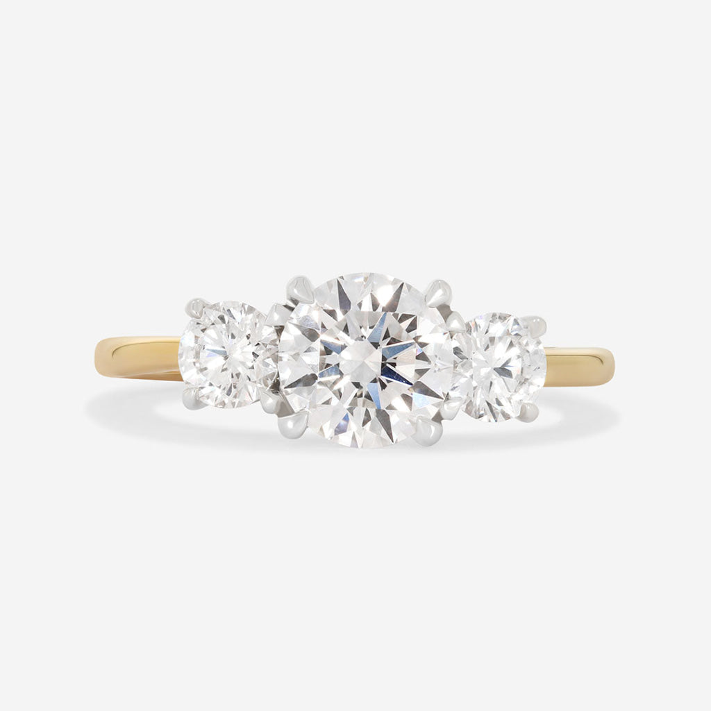 yellow gold three stone engagement ring