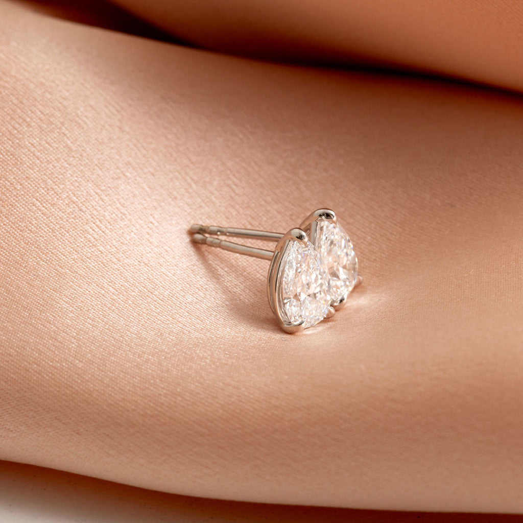 Side view of pear diamond earrings