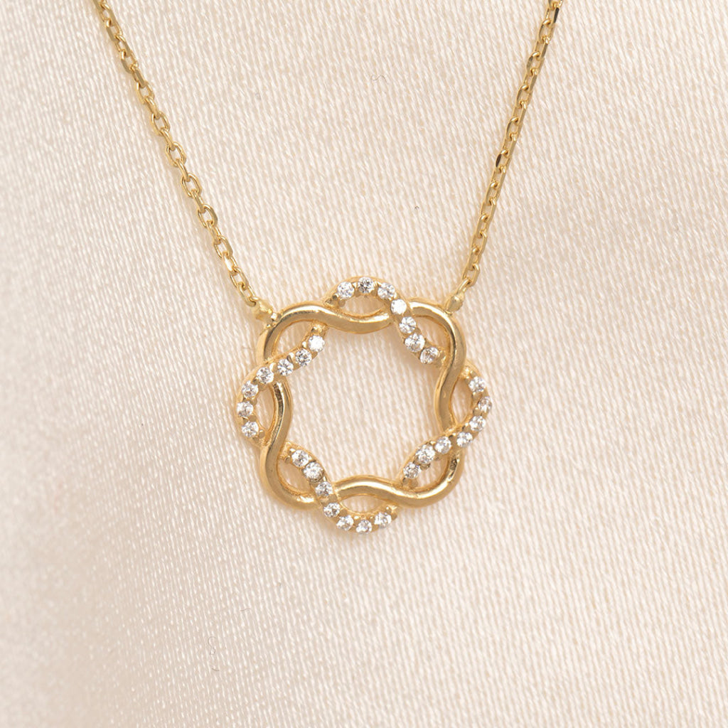 yellow gold and cubic zirconia twist circle necklace