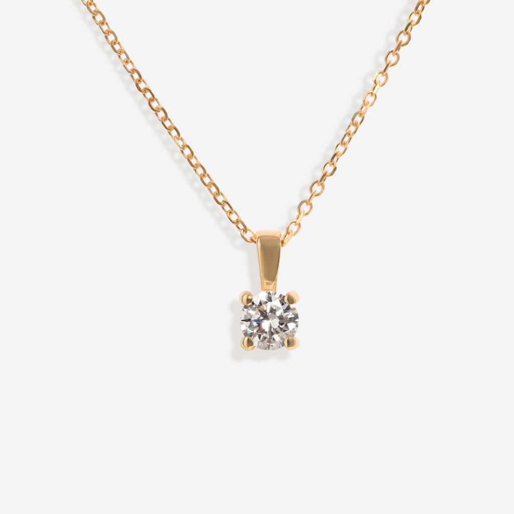 yellow gold diamond pendant on trace chain