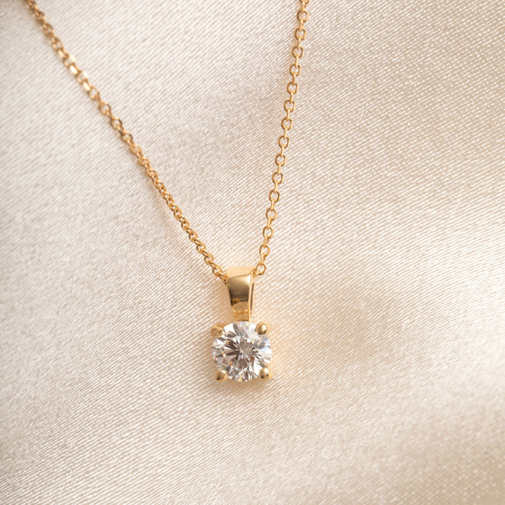 yellow gold diamond pendant on dainty chain