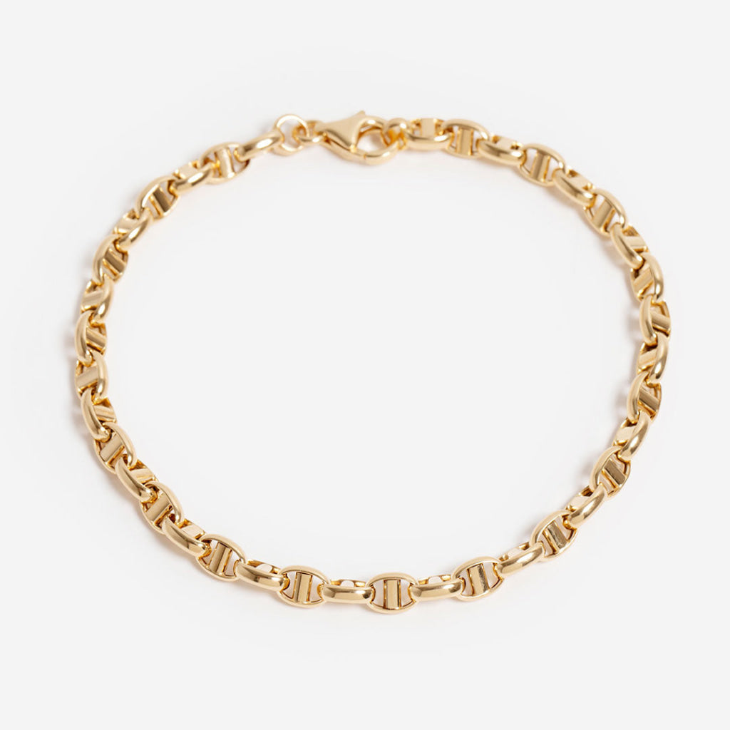 14ct gold fancy chain bracelet on a white background