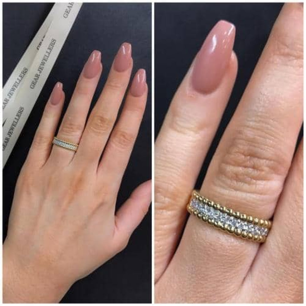 9ct Gold Diamond Wedding Ring on a woman's hand.