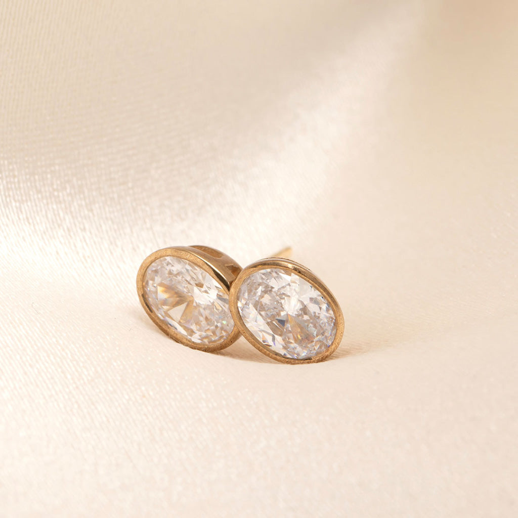 yellow gold bezel set oval cut stud earrings