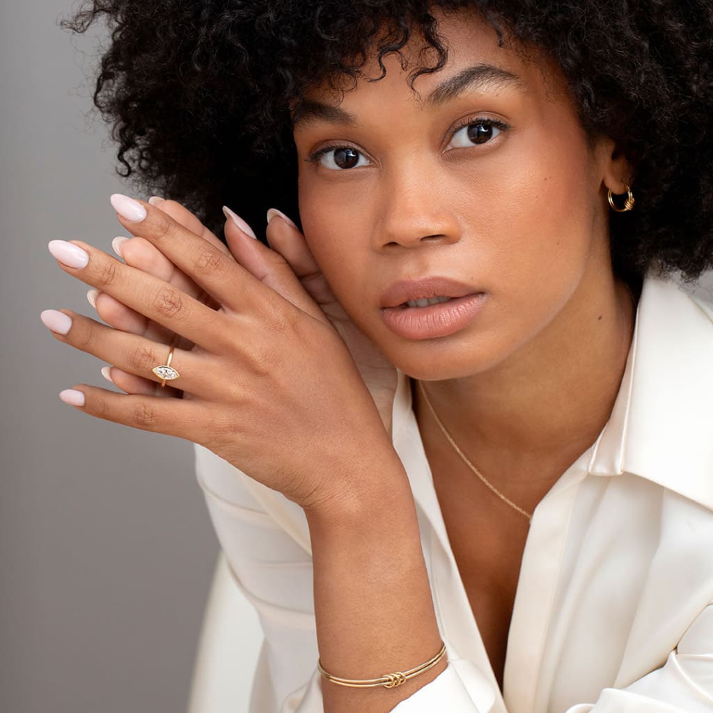 Model wearing Freda marquise diamond engagement ring