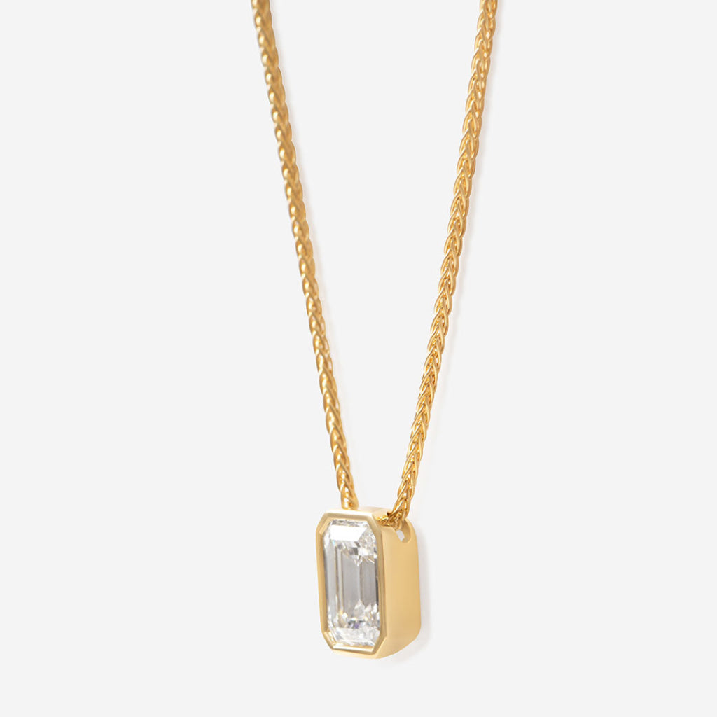 Emerald cut diamond necklace bezel