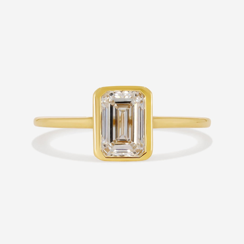 Freda emerald bezel set ring on white background